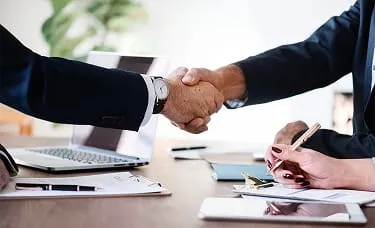 Business handshake meeting